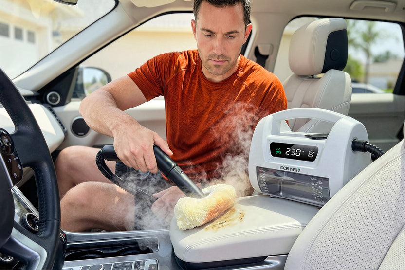 Steam-cleaning baked-on grime inside a built-in oven with the pearl white Goehner’s